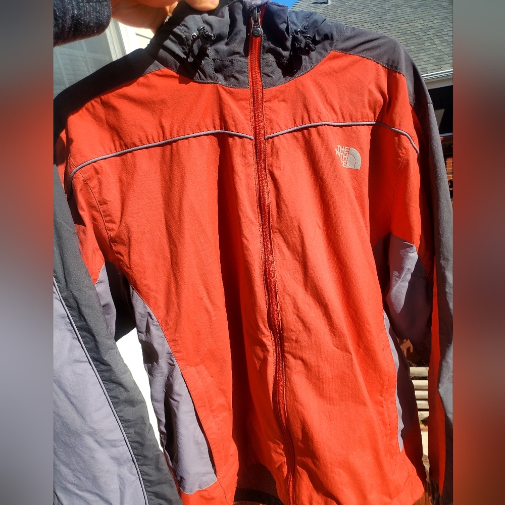 The North Face red & gray windbreaker full zip jacket w/ packable hood. Large